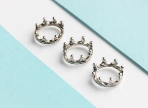 High angle of three silver crowns for epiphany day