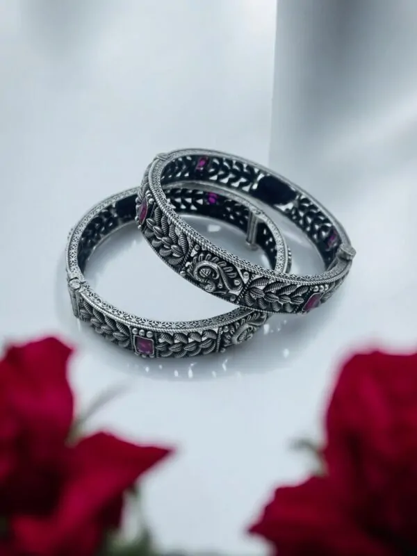 Elegant peacock‑motif stamped bangles